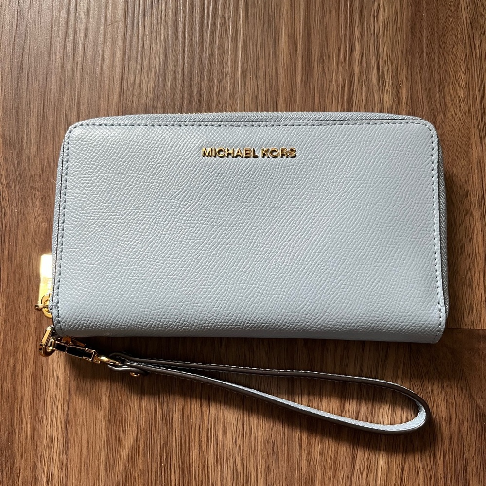 Michael Kors baby blue Wristlet with Gold Accents